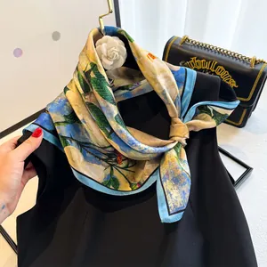 Detail of silk scarf with floral print and camellia brooch on black dress