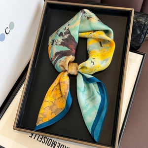 Detailed close-up of artistic silk scarf texture with vivid oil painting pattern