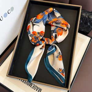 65cm premium silk square scarf with orange floral print in a luxury gift display