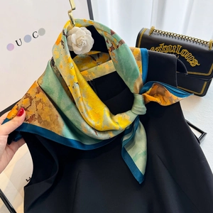 Artistic oil painting print silk scarf tied elegantly on a minimal black top