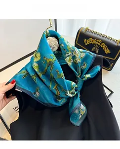Detail of 100% mulberry silk scarf with blue oil painting floral print and glossy finish