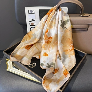 Elegant 100% silk square scarf featuring oil painting style orange floral prints