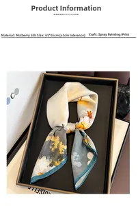Detailed view of mulberry silk scarf showing printed floral patterns and hand-rolled edges