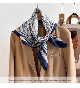 Detail of silk scarf with leopard print and chain pattern on khaki blazer lapel