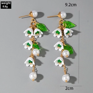 Close-up of lily of the valley tassel earrings with pearls and dimensions showing 9.2cm length