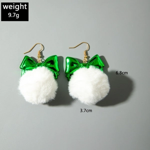 Detailed view of Christmas bow earrings with white fur balls and size specifications