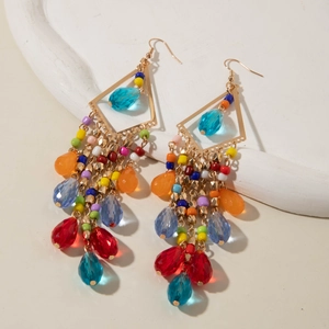 Detail of bohemian tassel earrings with colorful beads and crystal waterdrop pendants