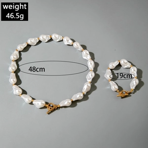 Detailed view of Baroque pearl necklace and bracelet with gold OT toggle clasp and beads