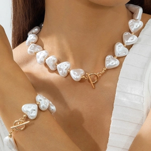 Elegant white heart-shaped baroque pearl necklace and bracelet set with golden OT toggle clasp
