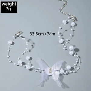 Detail of butterfly pearl necklace showing weight 7g and length 33.5cm plus 7cm extender