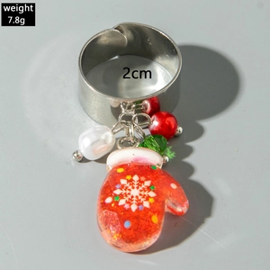 Detailed view of silver adjustable ring with Santa resin charm and pearl accents