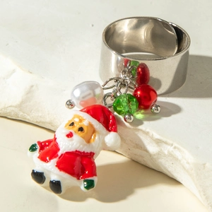 Detail of Santa Claus resin pendant with white pearl and green beads on silver ring
