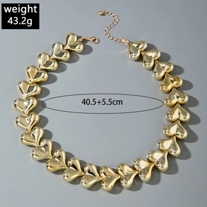 Detailed view of polished chunky heart-shaped links with lobster clasp and extension chain