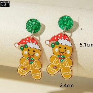 Détail de boucles d'oreilles bonhomme en pain d'épice avec dimensions 5,1cm x 2,4cm