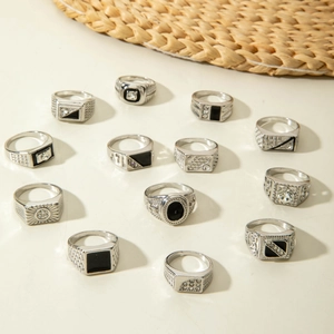 Detail of 12-piece silver alloy men's ring set with black enamel and zircon stones