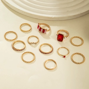 12-piece vintage gold alloy ring set featuring minimalist bands and red gemstone accents