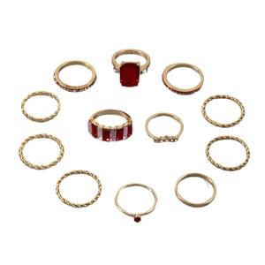 11-piece vintage gold alloy ring set featuring red gemstone and bohemian textures