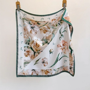 Floral print square silk scarf with peony patterns and butterfly elements in soft cream