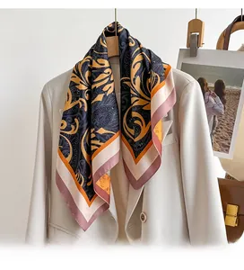 Close-up of baroque paisley silk scarf draped over a white suit jacket collar