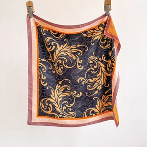 Navy blue paisley square silk scarf with orange paisley patterns and color-block borders