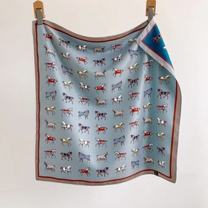 Light blue silk square scarf with colorful equestrian horse prints and red rolled edges