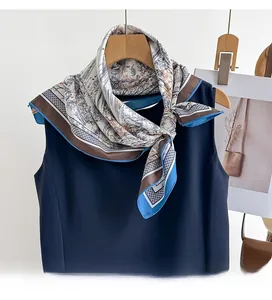 Detail of premium twill silk square scarf with landscape print on a sleeveless top