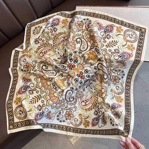 Vintage paisley silk-feel square scarf with floral pattern on leather background