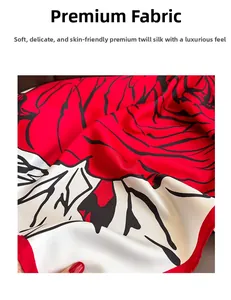 Close-up of vintage twill silk scarf showing smooth texture and red abstract patterns