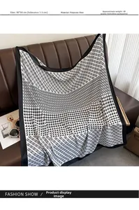Detail of 90x90cm houndstooth and chain print silk-feel polyester scarf on leather sofa