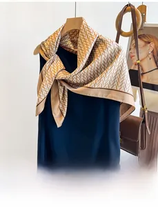 Detail of silk twill scarf featuring V-pattern texture and elegant dark border trim