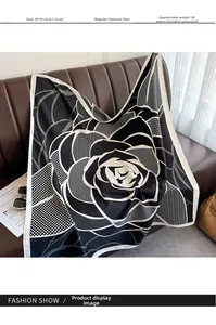 Detailed view of 90x90cm printed silk scarf with elegant black and white floral pattern