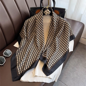 Elegant square silk scarf with V-letter geometric print in black and brown tones