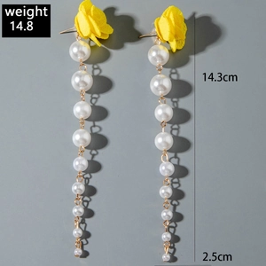 Detail view of yellow fabric tulip earrings with pearl tassels and size dimensions