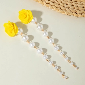Detail of tulip fabric earrings with yellow petals, white pearls and long tassels