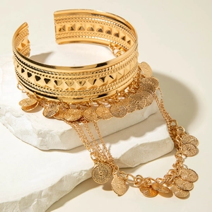 Bracelet de bras style cowboy doré avec chaînes à franges et pendentifs pièces vintage