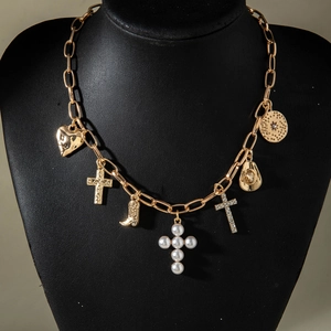 Bohemian gold chain necklace with western cowboy hat, cross, and heart charms on neck model