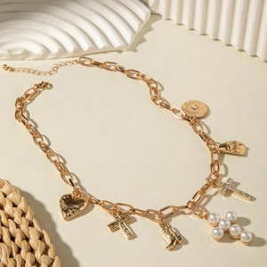 Bohemian gold chunky chain necklace featuring cowboy hat, cross, and heart charms