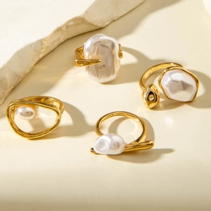 Luxurious gold-plated ring set featuring baroque pearls and geometric minimalist design
