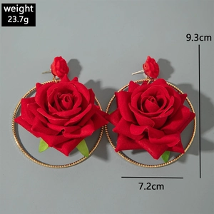 Detail shot of oversized red velvet rose hoop earrings with 7.2cm diameter and gold finish