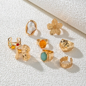 8-piece vintage gold-tone ring set with baroque pearls and colorful gemstones