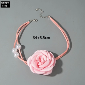 Detail of pink fabric rose choker with white faux pearls and measurement labels