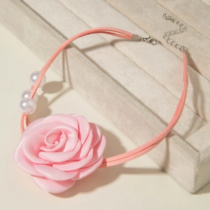 Detail of pink satin rose choker with three pearls and adjustable lobster clasp