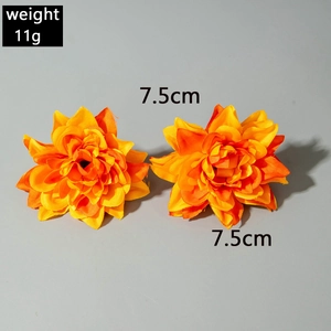 Detail of orange bohemian floral earrings with 7.5cm diameter and 11g lightweight feel
