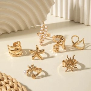 7-piece gold alloy ring set with starfish, sun, leaf motifs and white pearls for women