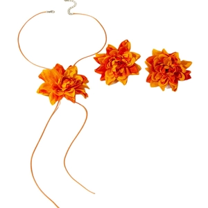Bohemian orange dahlia flower jewelry set featuring a layered fabric necklace and hair clips