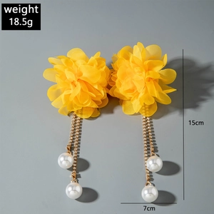 Detail view of yellow chiffon flower earrings with pearl tassels, size 15cm by 7cm