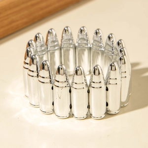 Macro view of silver CCB bullet bracelet featuring textured metallic punk design