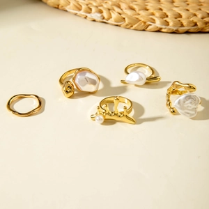 Five-piece golden Baroque irregular pearl ring set with geometric wave and crown designs