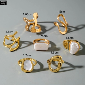 Golden 7-piece geometric ring set with baroque pearls and irregular vintage lava designs