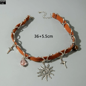 Detailed shot of retro sun pendant choker with leather cord and star charms 36+5.5cm